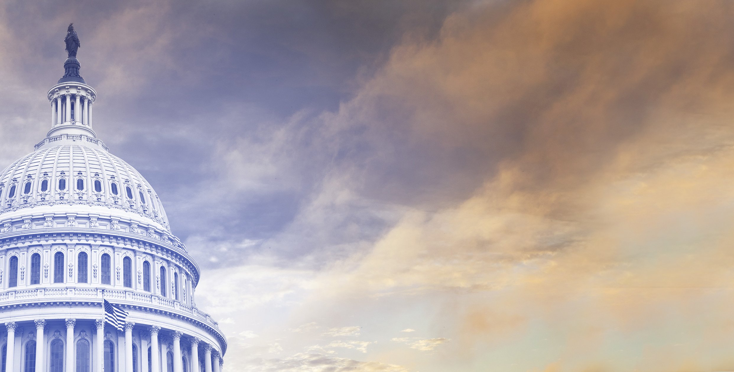 United States Capitol dome beneath a cloudy sky